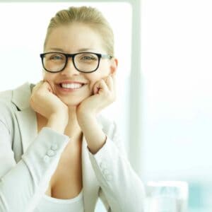smiling woman glasses on hands
